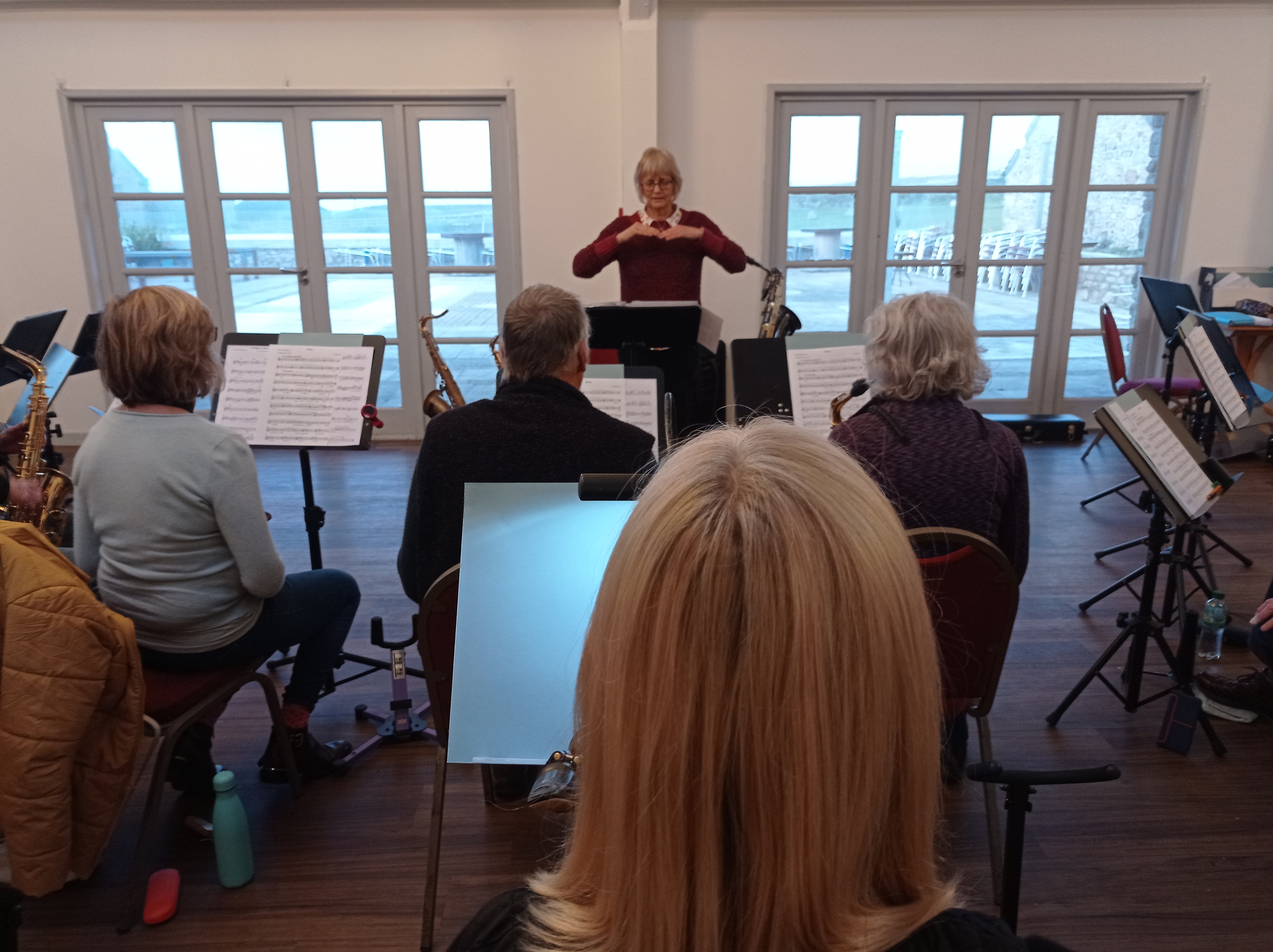 Cape Cornwall Saxophone Course - Karen Street with players in workshop. Saxophone choir, amateur music course