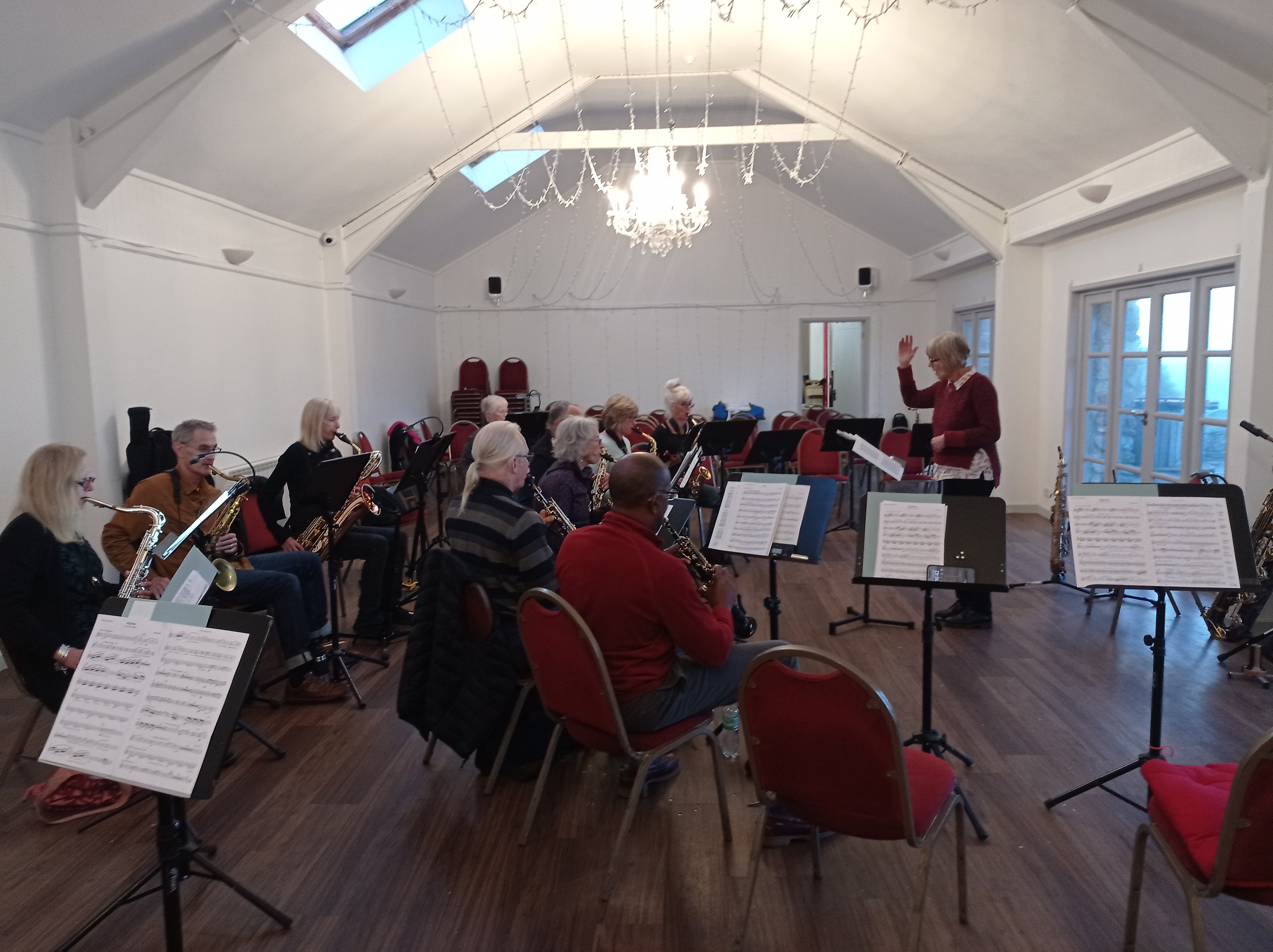 Cape Cornwall Saxophone Course - Karen Street rehearsal with sax band in Cape Cornwall Club events room. UK residential saxophone course, saxophone ensemble
