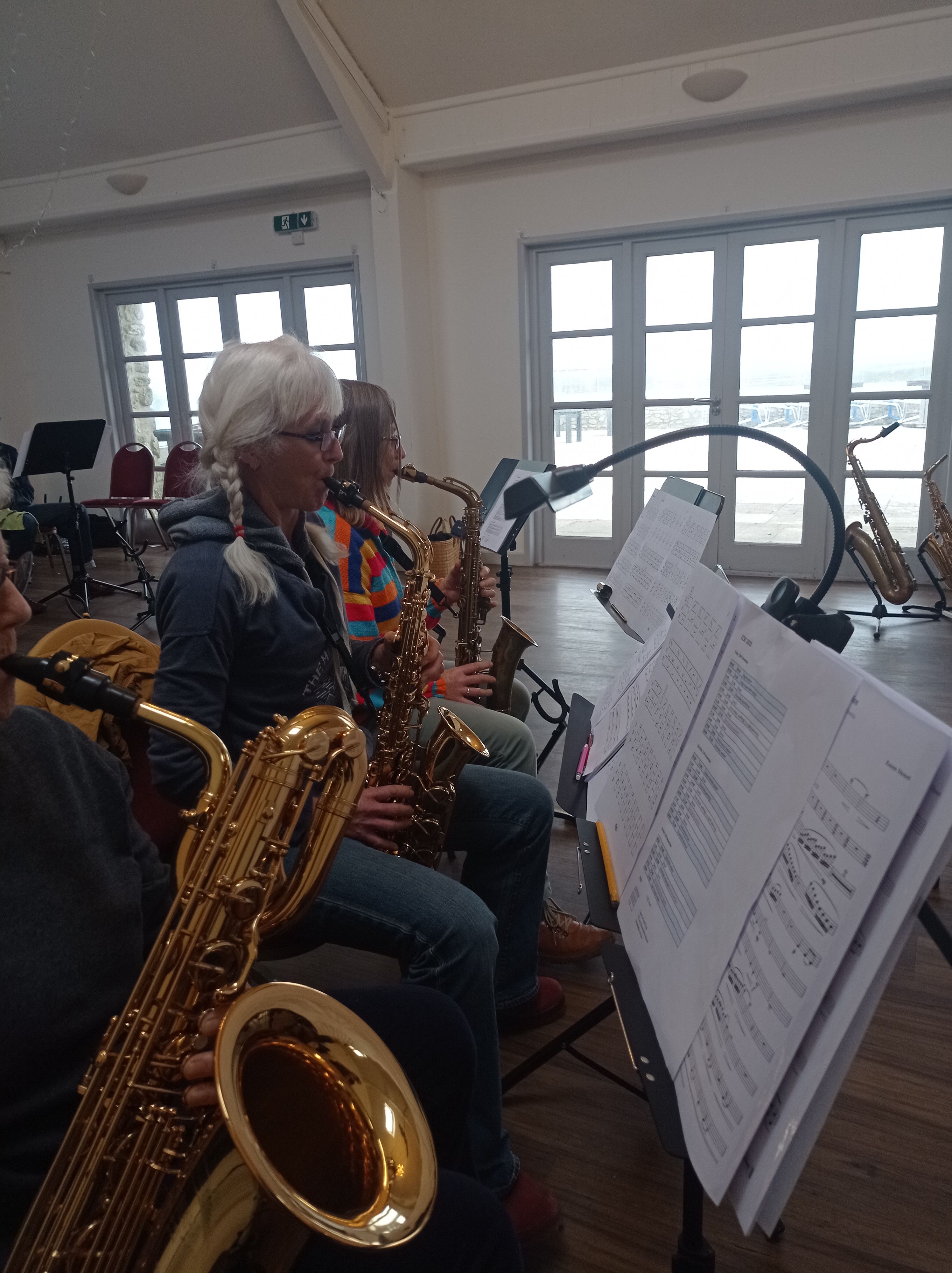 Cape Cornwall Saxophone Course - saxophonists rehearse. Baritone and alto saxophones, residential saxophone course